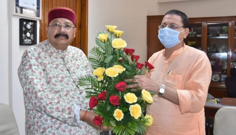 Pushkar Singh Dhami and Satpal maharaj